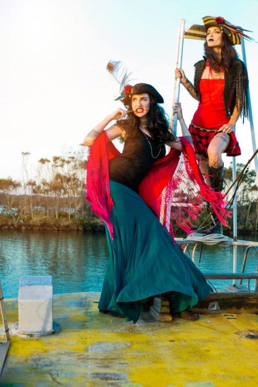 models fierce posing on fashion shoot on the the pirate boat