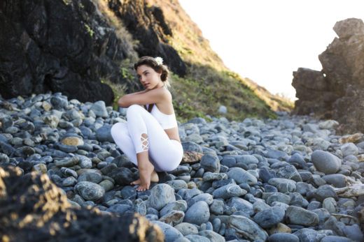 yoga clothing beach with model posing on watergos beach byron bay