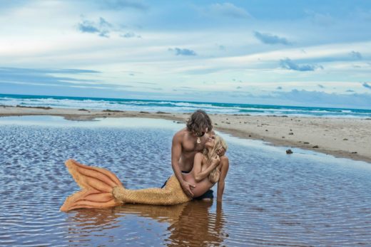 powerful image of couple in byron bay mermaid kazzie mahina by donatella parisini
